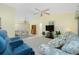 Spacious living room featuring a ceiling fan, and a view into other rooms at 2 Bunker Way, Rotonda West, FL 33947