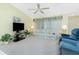 Inviting living room with comfortable seating, a ceiling fan, and bright lighting at 2 Bunker Way, Rotonda West, FL 33947