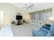 Comfortable living room with plush seating, ceiling fan, and natural light at 2 Bunker Way, Rotonda West, FL 33947