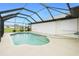 Screened-in pool area featuring a refreshing pool and sunny patio at 2 Bunker Way, Rotonda West, FL 33947