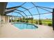 Enclosed pool with a clear view of the surrounding yard at 2 Bunker Way, Rotonda West, FL 33947