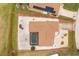 Aerial view of home with fenced pool, landscaping, neutral stone ground covering and standard driveway at 20 Bunker Way, Rotonda West, FL 33947