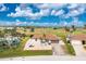 Aerial view of home located on a golf course with beautiful blue skies at 20 Bunker Way, Rotonda West, FL 33947