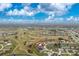 Aerial view of the property on a golf course with beautiful green surroundings at 20 Bunker Way, Rotonda West, FL 33947
