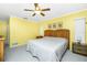 Comfortable bedroom featuring a wooden bed frame and neutral decor at 20 Bunker Way, Rotonda West, FL 33947