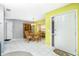 Bright foyer with tile floors, leading to the dining area with a modern chandelier and open layout at 20 Bunker Way, Rotonda West, FL 33947