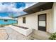 Inviting front entrance featuring a modern door and minimalist landscape at 20 Bunker Way, Rotonda West, FL 33947