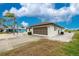 Single-Gathering home with a two car garage and a well-maintained lawn at 20 Bunker Way, Rotonda West, FL 33947