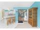 Bright kitchen with modern appliances, counter seating, and access to the pool area at 20 Bunker Way, Rotonda West, FL 33947