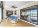 Relaxing lanai area with tile flooring, fan, table, and chairs at 20 Bunker Way, Rotonda West, FL 33947