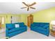 Inviting living area with comfortable sofas and neutral-toned walls, leading to the dining area at 20 Bunker Way, Rotonda West, FL 33947