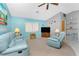 Living room with blue walls, comfortable furnishings, and tile flooring at 20 Bunker Way, Rotonda West, FL 33947