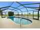 Sparkling screened pool with tile trim at 20 Bunker Way, Rotonda West, FL 33947