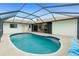 Screened in pool features step entry, and clear blue water at 20 Bunker Way, Rotonda West, FL 33947