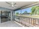 Relaxing screened balcony with tile flooring and view of the tropical exterior at 200 Rotonda W Blvd # A2, Rotonda West, FL 33947