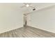 Bright bedroom with wood-look floors, ceiling fan, and a neutral color palette at 200 Rotonda W Blvd # A2, Rotonda West, FL 33947