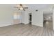 Bedroom with wood-look floors, neutral walls, closet, and access to ensuite bathroom at 200 Rotonda W Blvd # A2, Rotonda West, FL 33947