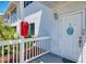 Inviting entrance featuring white door, house number, and well-kept surroundings at 200 Rotonda W Blvd # A2, Rotonda West, FL 33947