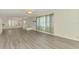 Bright living area with new floors showcases a slider to the backyard patio at 200 Rotonda W Blvd # A2, Rotonda West, FL 33947