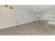 Expansive living area boasting fresh paint, new flooring, and easy access to other rooms at 200 Rotonda W Blvd # A2, Rotonda West, FL 33947