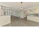 Spacious living area features an open floor plan to the kitchen and sleek floors at 200 Rotonda W Blvd # A2, Rotonda West, FL 33947