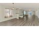 Bright living room boasting new flooring and natural light at 200 Rotonda W Blvd # A2, Rotonda West, FL 33947