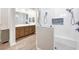 Spa-like bathroom with a large walk-in shower, dual shower heads, and a built-in niche at 213 Sunset Rd, Rotonda West, FL 33947