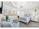 Cozy bedroom with tray ceiling, two chairs, neutral tones, and plenty of natural light at 213 Sunset Rd, Rotonda West, FL 33947