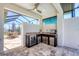 Entertainer's dream outdoor kitchen with stainless appliances in screened lanai offers style and function at 213 Sunset Rd, Rotonda West, FL 33947