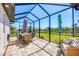 Enjoy outdoor living in screened lanai with dining area and comfortable seating, perfect for relaxation at 213 Sunset Rd, Rotonda West, FL 33947