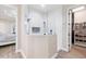 Modern tiled shower with glass enclosure and sleek fixtures, adjacent to a walk-in closet at 213 Sunset Rd, Rotonda West, FL 33947