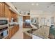 Spacious kitchen featuring granite countertops, stainless appliances, and a view to the dining area at 25 Medalist Ter, Rotonda West, FL 33947