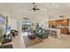 Bright living room with open layout, bar seating, and seamless access to the outdoor lanai at 25 Medalist Ter, Rotonda West, FL 33947