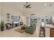 Cozy living room with neutral tones, tile flooring, comfortable seating, and natural light at 25 Medalist Ter, Rotonda West, FL 33947