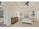 The spacious main bedroom features a ceiling fan, natural light, and views of the backyard at 25 Medalist Ter, Rotonda West, FL 33947
