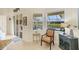 Bright sunroom with views of the pool area and comfortable seating at 25 Medalist Ter, Rotonda West, FL 33947