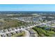 Breathtaking aerial shot of a suburban community surrounded by verdant landscapes and tranquil ponds at 284 Talquin Ct, Englewood, FL 34223