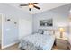 Cozy bedroom featuring queen bed, coastal-themed bedding, and double door closet at 284 Talquin Ct, Englewood, FL 34223