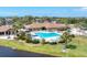 A community pool and hot tub offer a great place for residents to socialize and relax at 284 Talquin Ct, Englewood, FL 34223