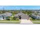 Inviting single-Gathering home with a two-car garage, well-manicured lawn, mature landscaping, and a charming facade at 284 Talquin Ct, Englewood, FL 34223
