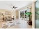 Cozy living room with stylish rug, comfortable seating, and large sliding glass doors to the backyard at 284 Talquin Ct, Englewood, FL 34223