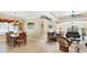An open floor plan of the dining and living room with plush leather furniture at 284 Talquin Ct, Englewood, FL 34223