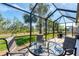 Relax in this screened-in lanai with a dining area with an outdoor view at 284 Talquin Ct, Englewood, FL 34223