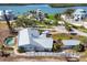 Aerial view of single Gathering home with pool, and private boat dock in backyard at 400 Anchor Row, Placida, FL 33946