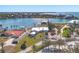 Panoramic aerial view of the waterfront property with tropical landscaping and sparkling blue water at 400 Anchor Row, Placida, FL 33946