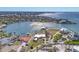 Waterfront property aerial view highlighting the home, boat dock, landscaping, and location on the serene waterfront at 400 Anchor Row, Placida, FL 33946