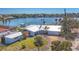 Modern home with a clean design, featuring a well-manicured lawn and a detached building at 400 Anchor Row, Placida, FL 33946