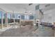Bright kitchen area with an open layout and large windows offers an inviting space for culinary creations and dining at 400 Anchor Row, Placida, FL 33946