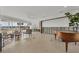 Bright living room with waterfront views, terrazzo floors, and an open layout offers flexible design possibilities at 400 Anchor Row, Placida, FL 33946