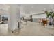 Spacious living room with water view, open floor plan, and terrazzo flooring provides a blank slate for remodeling at 400 Anchor Row, Placida, FL 33946
